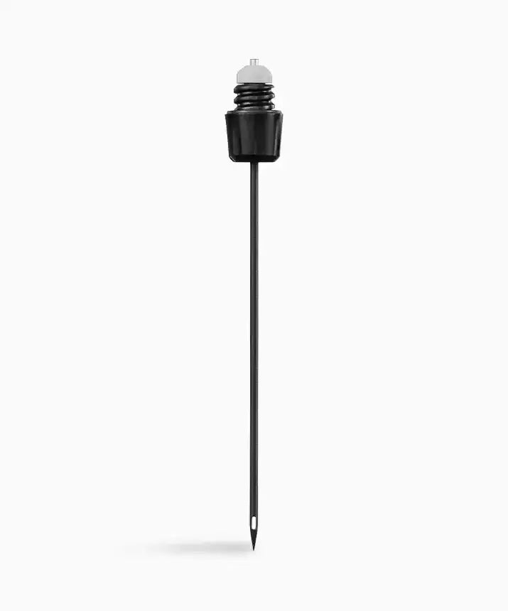 Coravin Standard Needle - A black needle with a white cap, designed to pierce through cork for pouring wine without opening the bottle. Made of stainless steel with a non-stick coating. Compatible with Timeless Three and Six Systems.
