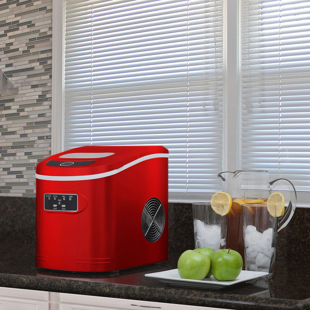 A compact red ice maker with buttons and a fan, capable of producing up to 27 pounds of ice per day. No plumbing required.