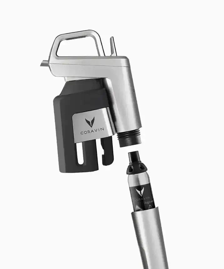 A silver and black device with a black cap, compatible with Coravin Timeless and Pivot™ Wine Preservation Systems.