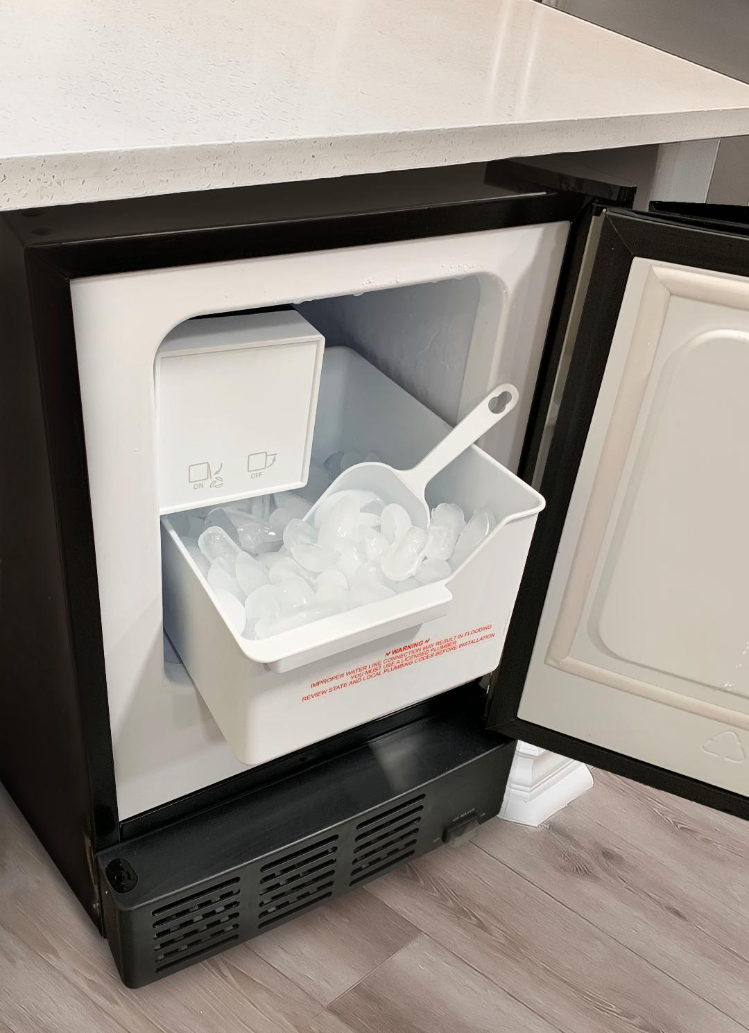 A stainless steel built-in ice maker with crescent-shaped ice cubes, capable of making 12 lbs of ice in 24 hours and storing 6 lbs of ice.
