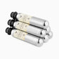 A group of silver cylinders with black caps, compatible with the Coravin Sparkling™ System, used to preserve the taste and effervescence of sparkling wine for up to 4 weeks.