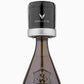A black-capped bottle of Coravin Sparkling Wine Preservation System, with a close-up view.