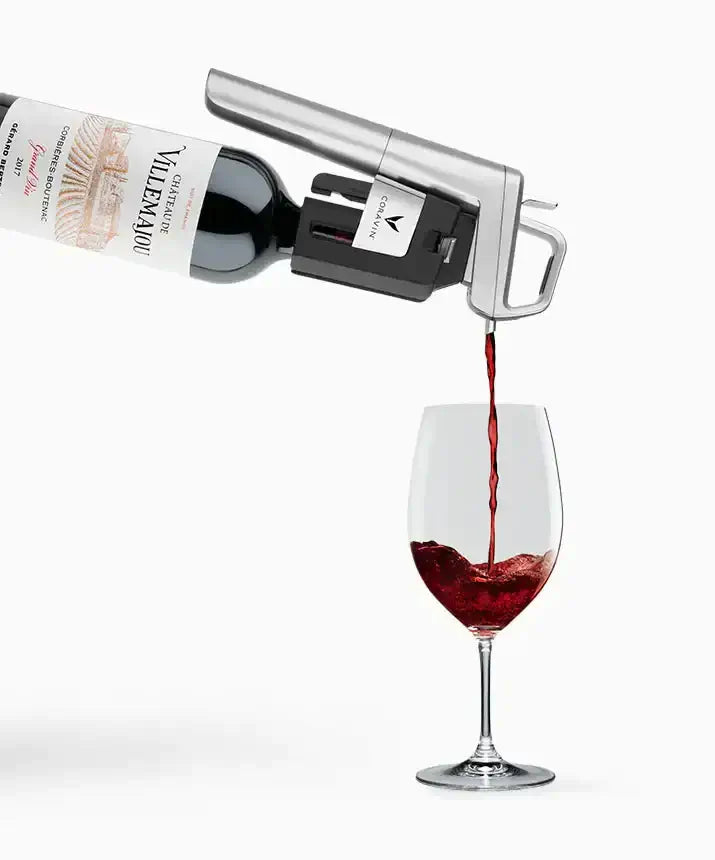 Coravin Timeless Six+ Wine Preservation System pouring wine into a glass