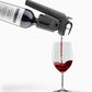 Coravin Timeless Three+ Wine Preservation System pouring wine into a glass with a corkscrew bottle nearby.