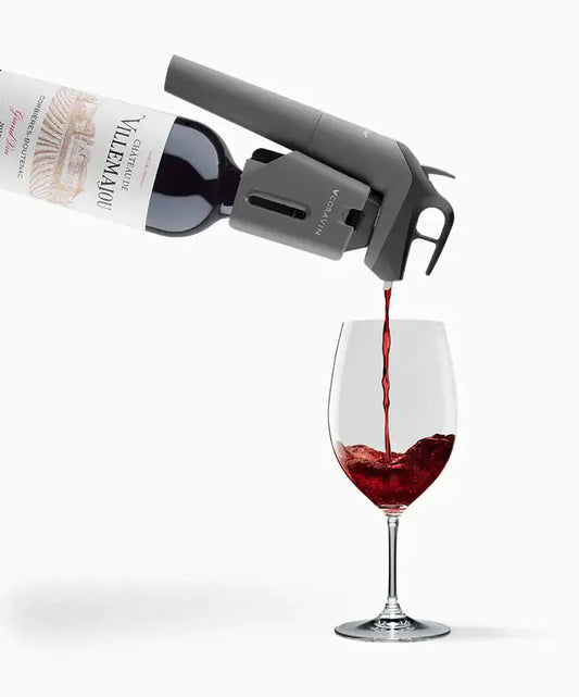Coravin Timeless Three SL Wine Preservation System pouring wine from bottle to glass