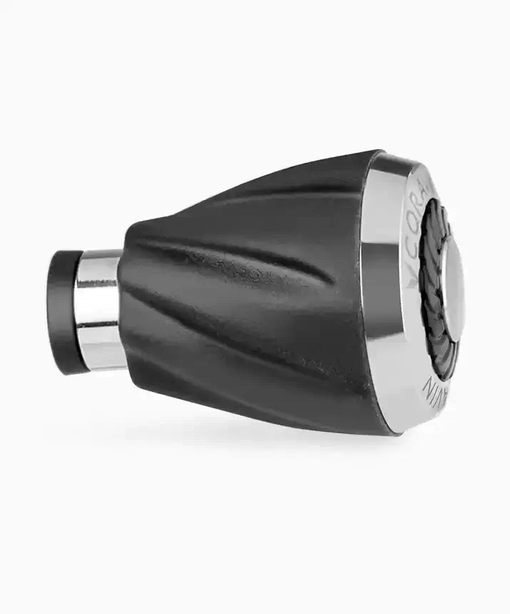 A close-up of the Coravin Timeless Aerator, a black and silver object with a round metal base. Designed to enhance the taste of wine, it rapidly aerates as you pour, yielding silky, smooth, aromatic results. Compatible with Coravin Timeless Systems.