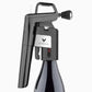 A black Coravin Timeless Aerator attached to a Coravin Timeless Wine Preservation System, enhancing the taste of wine.