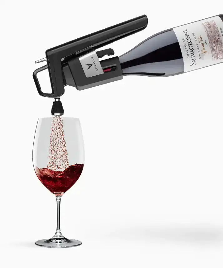 Coravin Timeless Aerator being used to pour wine into a glass