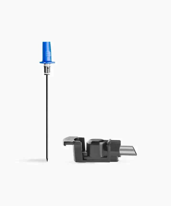 Coravin Eleven Standard Needle and Spout Kit: A close-up of a black cable and plug.