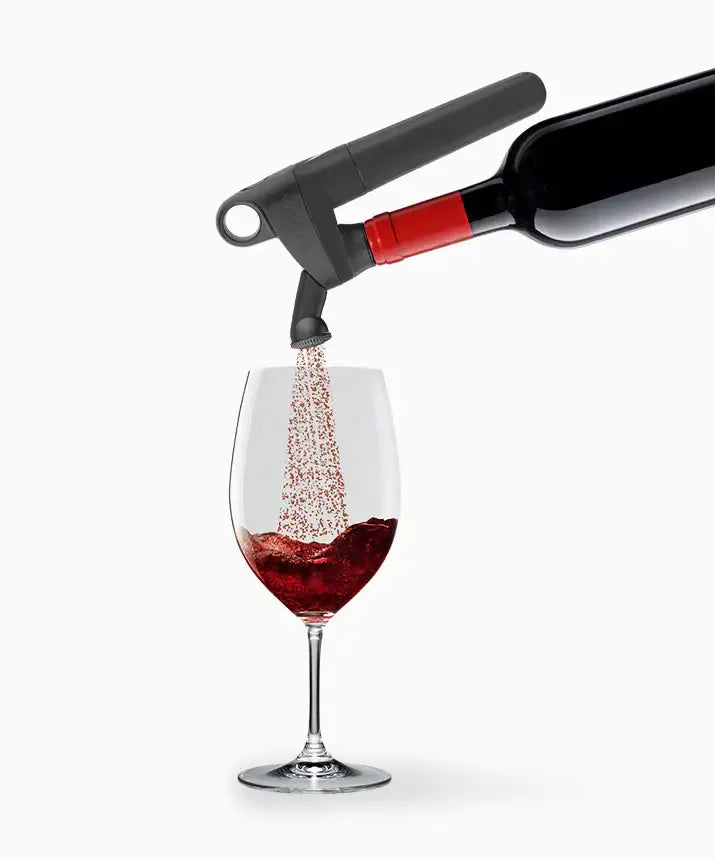 Coravin Pivot™ Aerator: A black and red wine bottle pouring red wine into a glass, enhancing aroma and flavor. Compatible with Pivot Wine Preservation Systems.