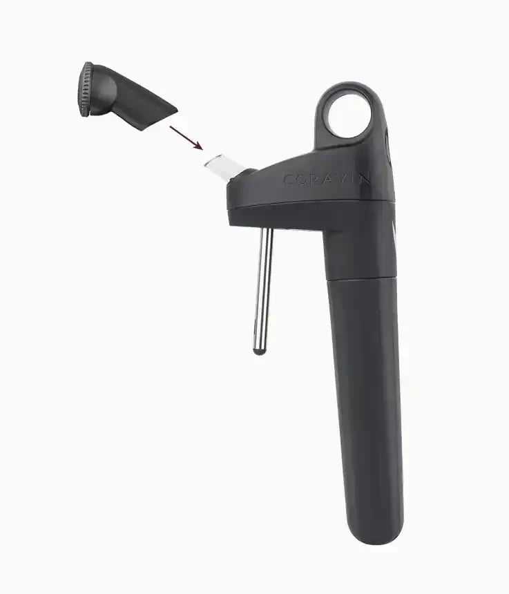 Coravin Pivot™ Aerator: A black device with a handle, designed for use with Pivot Wine Preservation Systems, aerating wine as you pour for enhanced flavor.