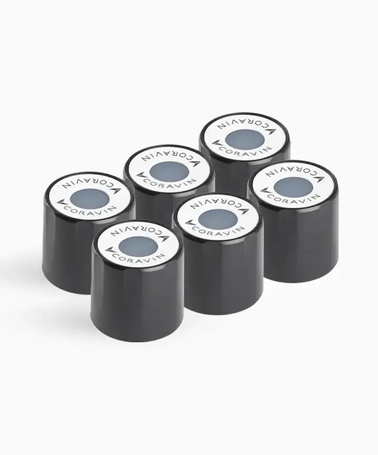A group of black cylindrical screw caps for the Coravin Timeless Wine Preservation System. Compatible with most screw cap bottles.