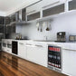 A Kings Bottle 24" Beer Cooler Fridge with a glass door and stainless steel trim, filled with beer and cans.