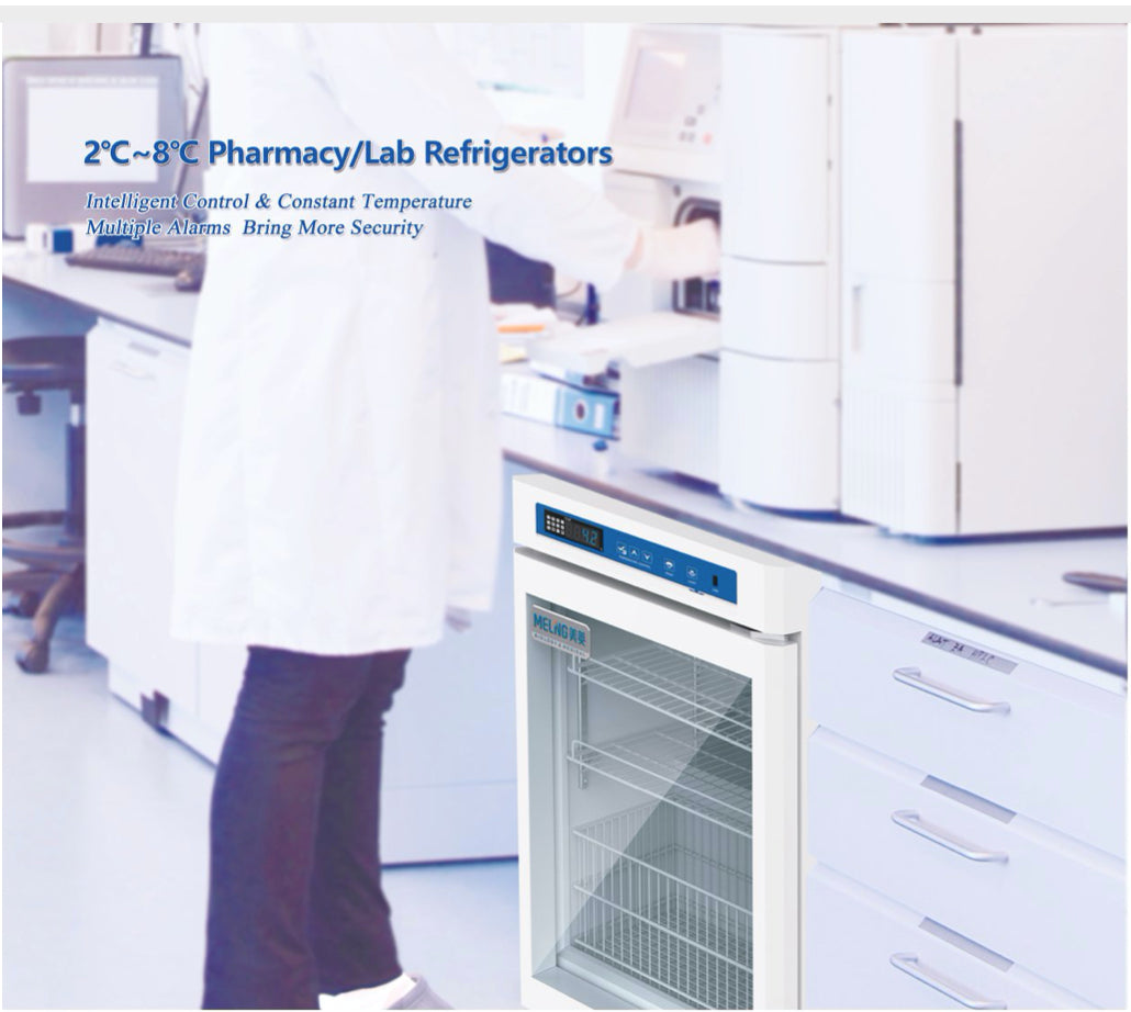 A person in a lab coat using the Kings Bottle 55L Compact Medical Grade Pharmacy Refrigerator.