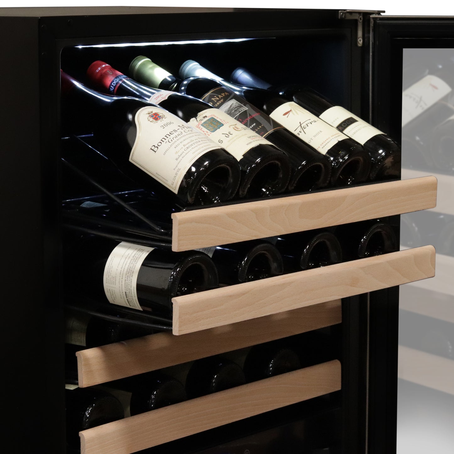 A wine cellar with bottles of wine displayed in the Whynter 164 Bottle Built-in Stainless Steel Dual Zone Compressor Wine Refrigerator.