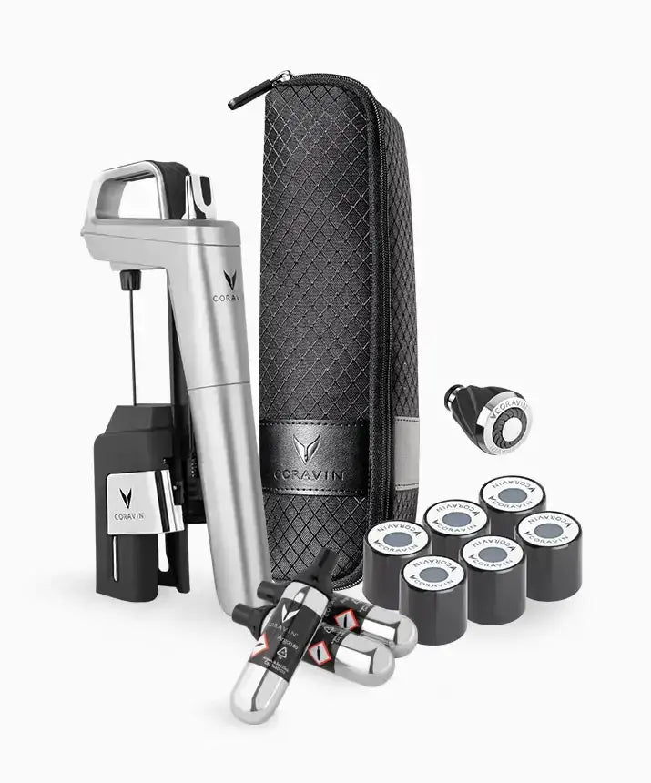 A black and white photo of a Coravin Timeless Six+ Wine Preservation System, featuring a group of objects next to each other, including a cylinder.